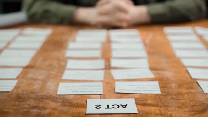 Scene and act cards arranged on a table for story planning