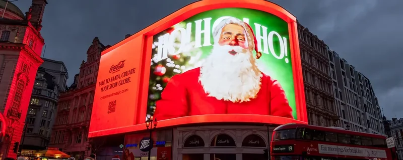 Coca-Cola Santa campaign on a large outdoor display